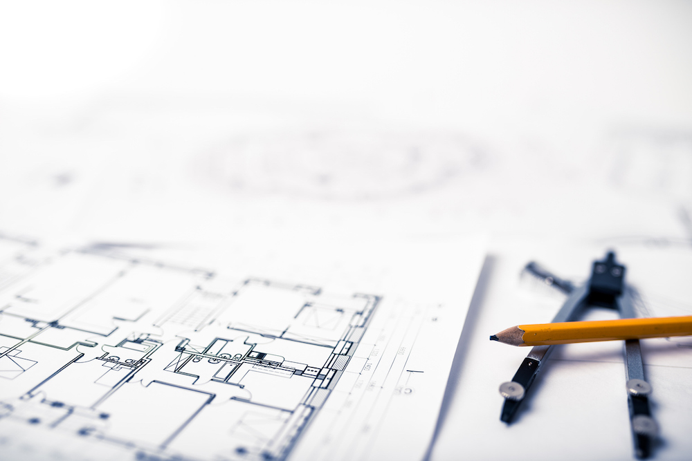A new housing project Blueprints on the architects desk